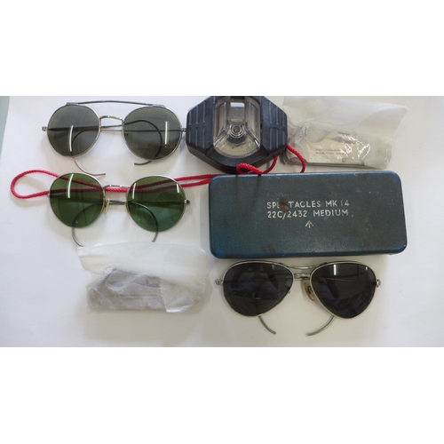 963 - 3 pairs of WWII British pilot's sunglasses. Also includes 2 unused British army penknives and a comp... 