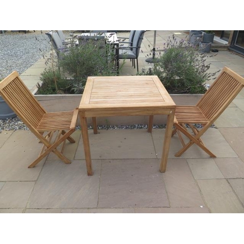 12 - A new boxed teak bistro table 70cm x 70cm and two folding dining chairs.