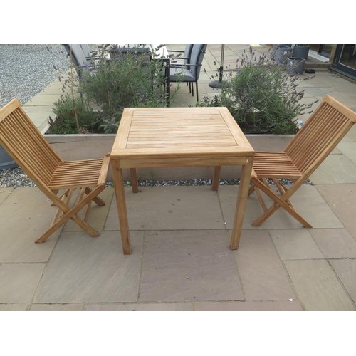 8 - A new boxed teak bistro table 70cm x 70cm and two folding dining chairs.