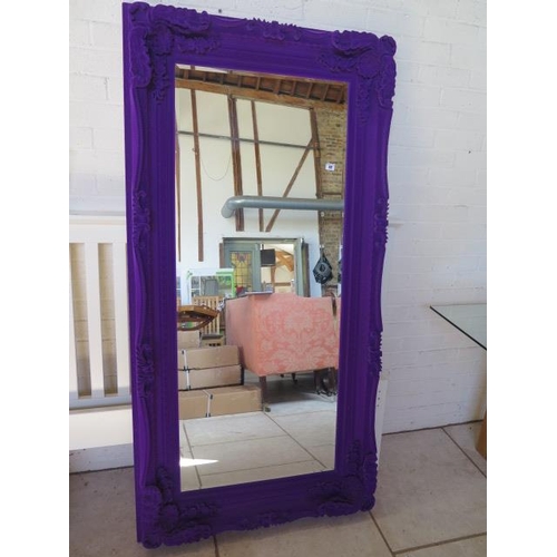 42 - An ornate purple fabric effect mirror, 176 cm x 90 cm