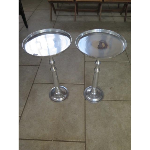 45A - A pair of polished metal side tables, 66 cm tall x 35 cm
