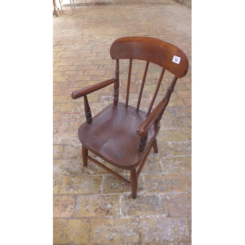 54 - A child's ash and elm armchair, initialled SH, 64cm tall in good condition with some old traces of w... 