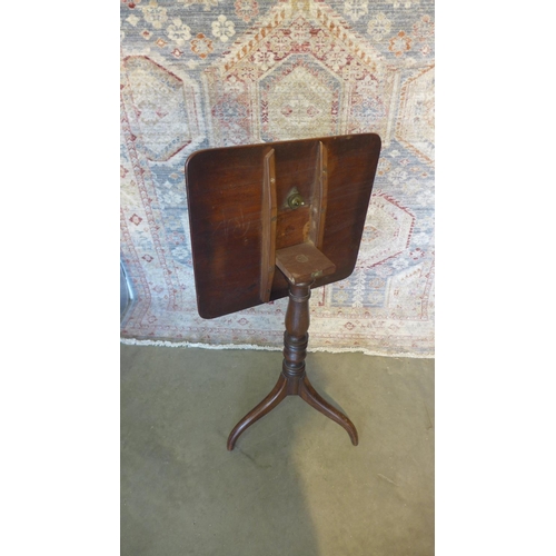 70 - A Georgian mahogany tilt-top tripod side table. 72cm tall. 50 x 45cm.