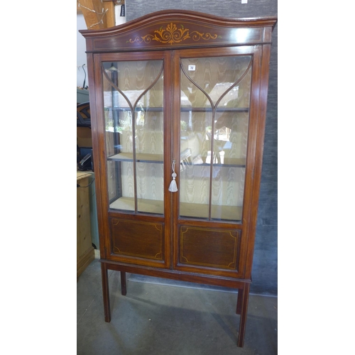 72 - An Edwardian mahogany and inlaid display cabinet. 180cm high, 87cm wide, 28cm deep.