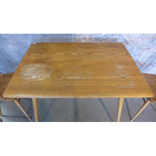 9 - An Ercol Elm table and 4 chairs. Table 73cm tall 99 x 68cm, chairs 80cm tall, all solid, all have sc... 