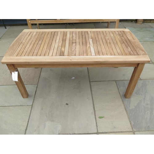 25 - A boxed teak coffee table, new and boxed, 120cm x 60cm