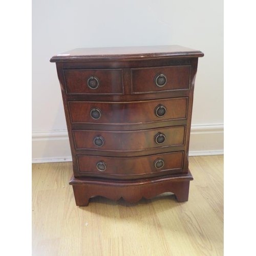 31 - A small bowfront chest of four drawers,, 53cm tall x 42cm x 33cm
