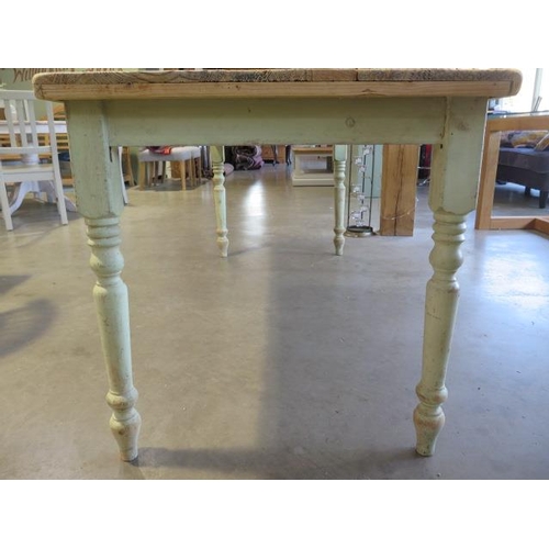 32 - A pine kitchen table with a stripped top on  painted turned legs, 76cm tall x 186cm x 76cm