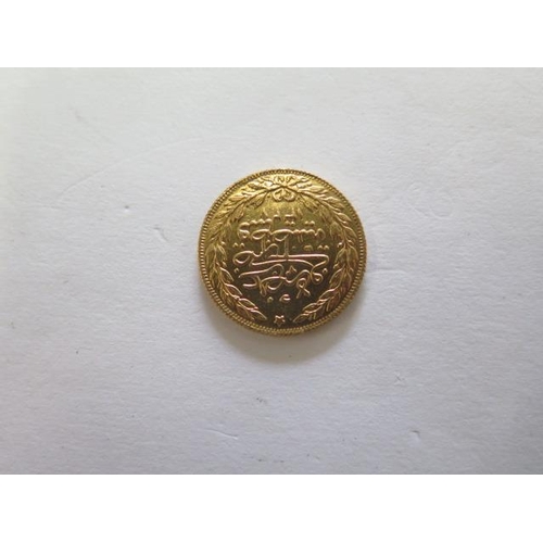 921 - A Turkish gold 100 Kurush coin, approx 7.2gs