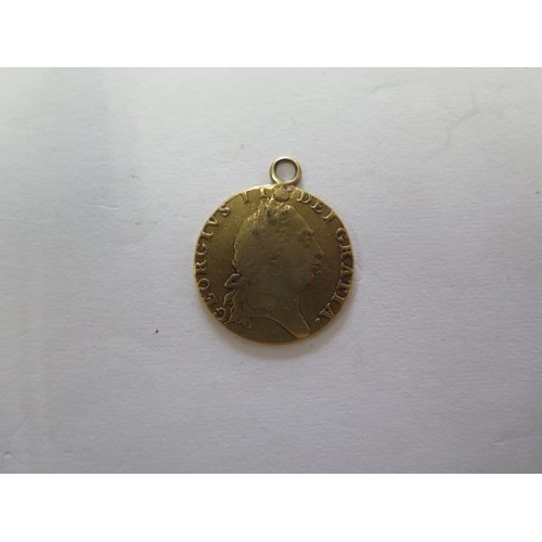 923 - A George III gold spade Guinea dated 1792 with a pendant mount, total weight approx 8.4gs

Removed f... 