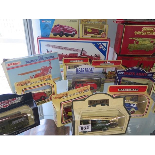 952 - A collection of 30 diecast fire engines including a kit, all boxed