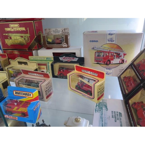 952 - A collection of 30 diecast fire engines including a kit, all boxed