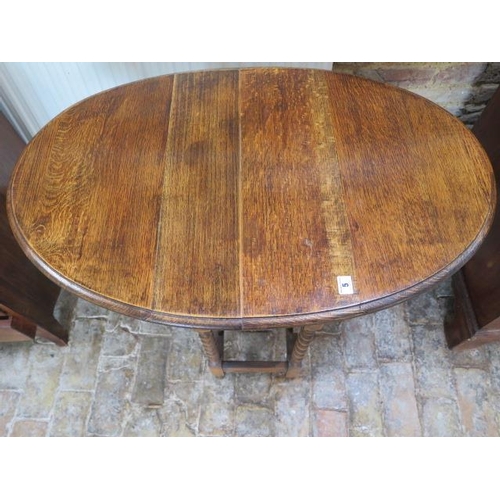 104 - A 1930's oak barleytwist dropleaf side table, 71cm tall x 60cm x 90cm