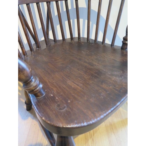 100 - An ash and elm stick back Windsor chair, stamped 1938 to the underside, 106cm high, general age rela... 