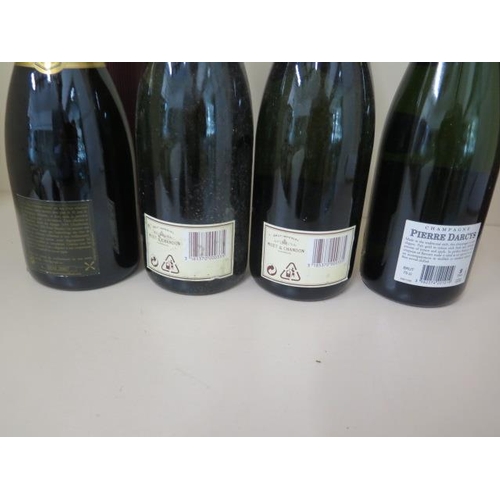 1151 - Two bottles of Moet and Chandon Brut Imperial Champagne, a bottle of Pierre Darcys Brut champagne an... 