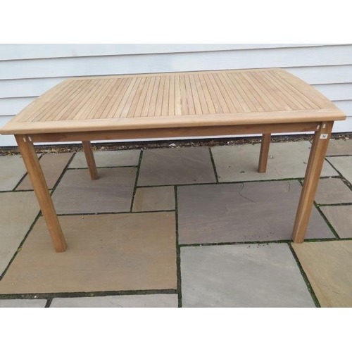 14 - A teak garden table, 150cm long x 90cm wide