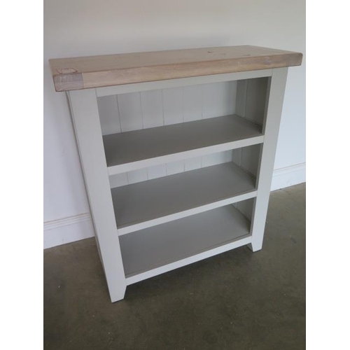 17 - A painted open bookcase with an oak top, 90cm high x 80cm wide, ex-display as new