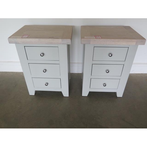18 - A pair of painted three drawer bedside chests with chalked oak tops, 62cm high x 47cm wide, ex-displ... 