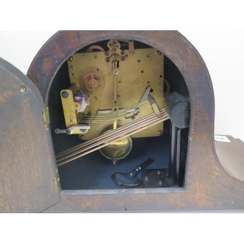209 - An 8 day oak case mantle clock with Westminster chimes, 45cm wide, running in saleroom