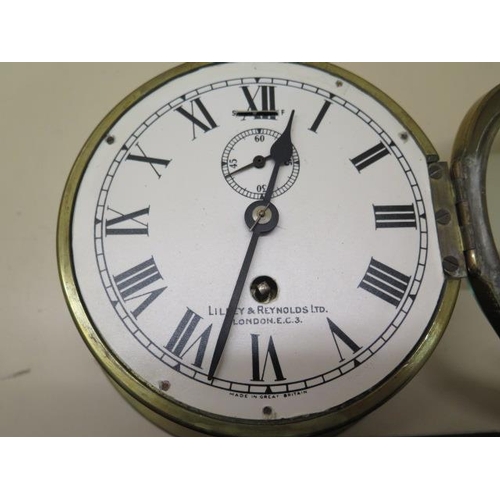 216 - A brass cased ship's wall clock by Lilley and Reynolds Ltd, London E.C.3, slow/fast adjustment and s... 
