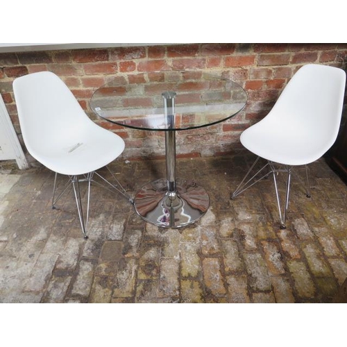 28 - A glass topped table on a stainless steel base, 80cm diameter, and two matching chairs, as new
