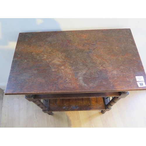 52 - An oak three tier side table, probably Liberty & Co, with lattice work sides on short turned legs, 7... 