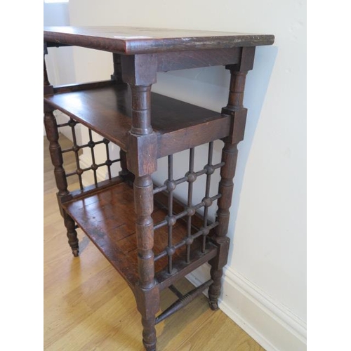 52 - An oak three tier side table, probably Liberty & Co, with lattice work sides on short turned legs, 7... 