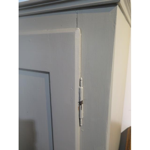 54 - A painted pine cupboard with hinged door and four internal shelves, 137cm tall x 63cm wide x 37cm de... 