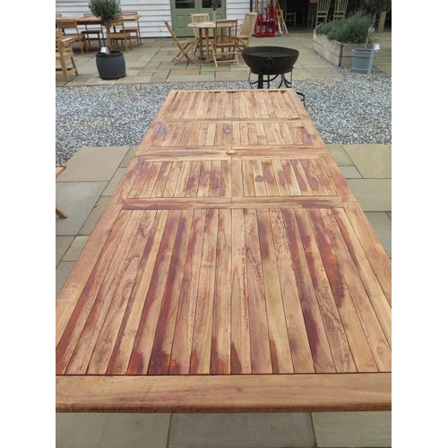 6 - A teak extending garden table with two leaves measuring 3m x 1.10m, new ex-display