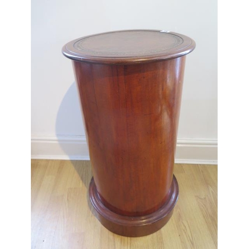 63 - A mahogany round bookcase with leather top, 73cm tall x 39cm diameter, generally good condition