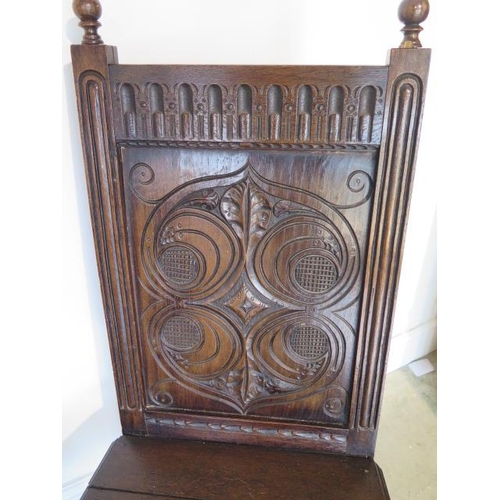 74 - A pair of oak hall chairs with carved backs and frieze, 107cm tall x 52cm wide