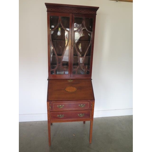 78 - An Edwardian inlaid mahogany two drawer bureau bookcase with a fitted interior standing on square ta... 