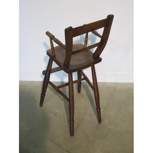 82 - A Victorian child's elm high chair, 80cm tall in good polished condition