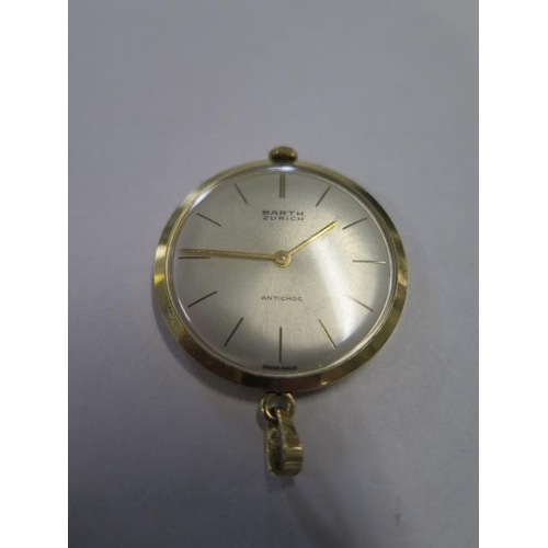 935 - An 18ct yellow gold Barth of Zurich antichoc lapel watch, manual wind, 34mm wide, hands advance and ... 