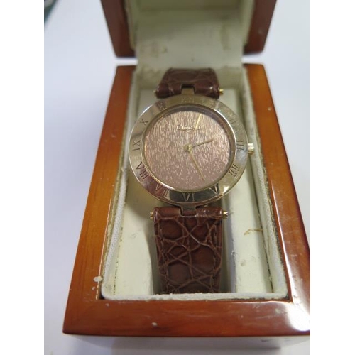 936 - A 9ct gold cased quartz Clogau wrist watch, hallmarked, serial number 00006, with leather strap and ... 