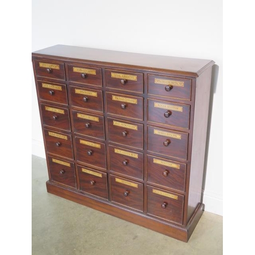 94 - A mahogany chemist apothacary chest with 20 named graduating drawers incorporating 19th century and ... 