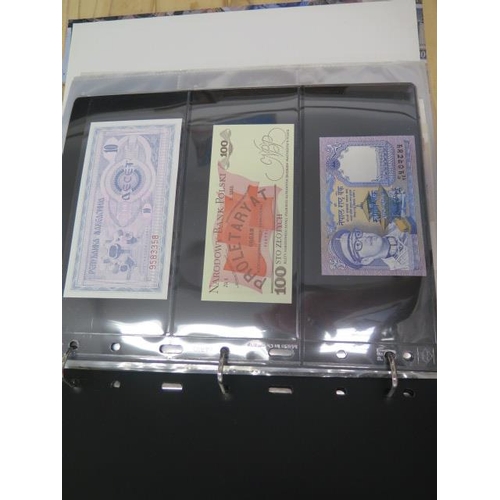 954 - A folder of 70 World banknotes and assorted world coins