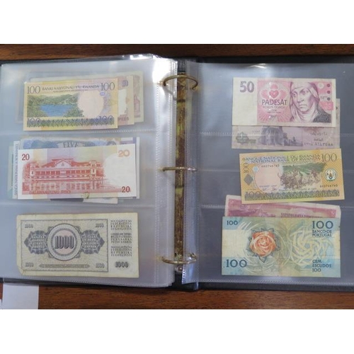 958 - An album containing a vintage banknote collection