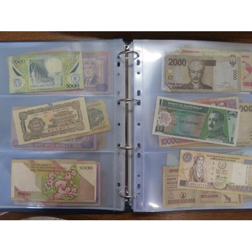 959 - An album containing 138 World bank notes