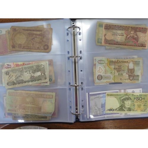 959 - An album containing 138 World bank notes