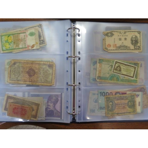 959 - An album containing 138 World bank notes