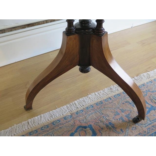 113 - An Edwardian fine rosewood tripod table with inlaid shaped top on three turned and reeded column and... 