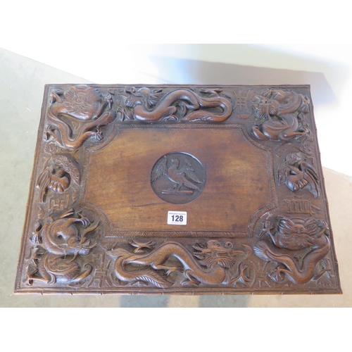 128 - A 19th century Chinese hardwood work box with hinged lid and all over carved dragon detail over a si... 