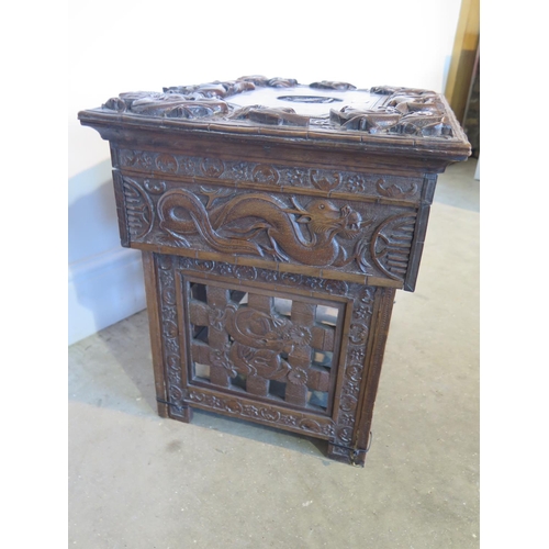 128 - A 19th century Chinese hardwood work box with hinged lid and all over carved dragon detail over a si... 
