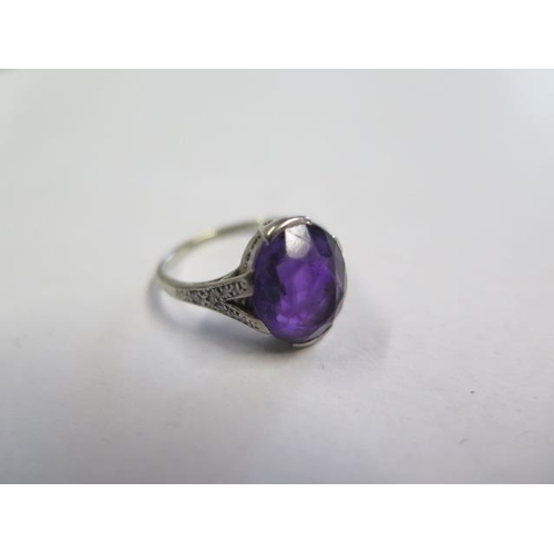 622 - A platinum amethyst ring, amethyst approx 11.5mm x 10mm x 6mm, set with small diamonds to the should... 