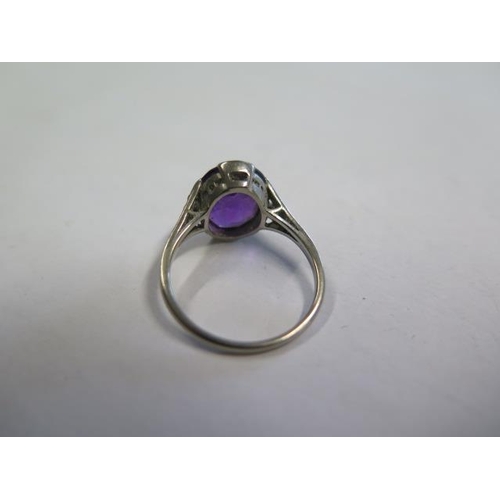 622 - A platinum amethyst ring, amethyst approx 11.5mm x 10mm x 6mm, set with small diamonds to the should... 