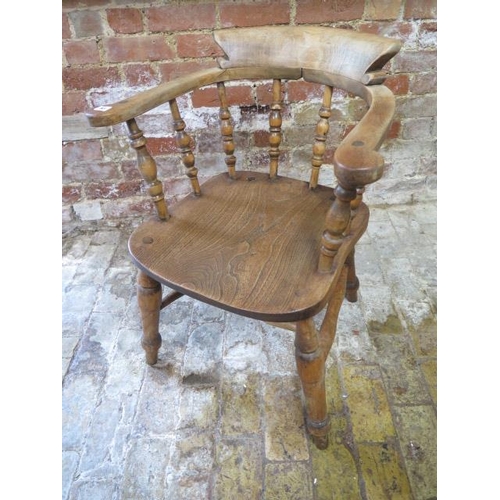 83 - A Victorian ash and elm smokers bow armchair, 79cm tall x 61cm wide, in sturdy condition