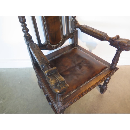 82 - A 19th century oak throne chair, the crested rail with carved lion and unicorn over a brown leather ... 