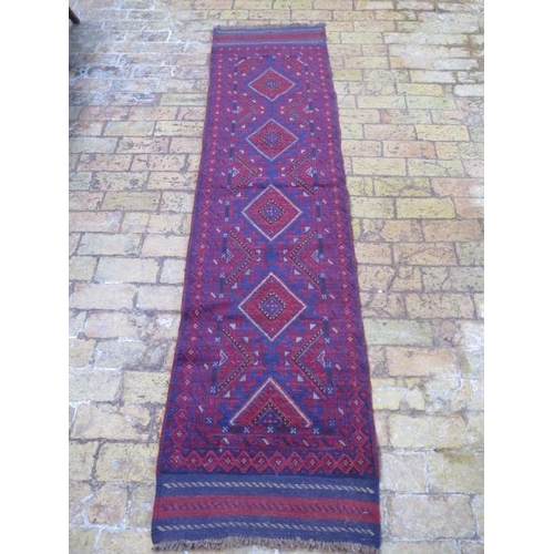 266 - A new hand knotted woollen Meshwani runner, 2.47m x 0.6m