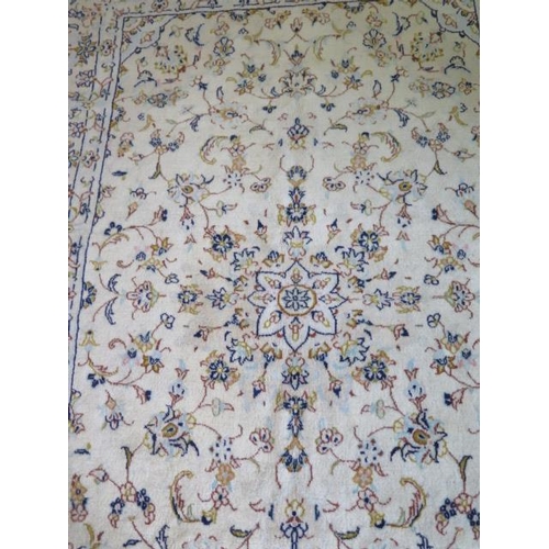 259 - A hand knotted woollen Kashan rug, 2.12m x 1.45m, in generally good condition